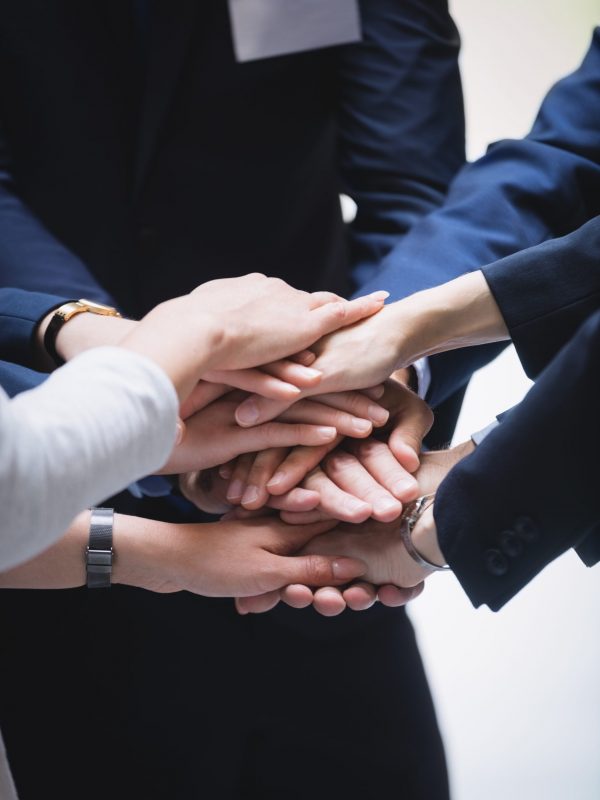 close-up of hands stack of business people